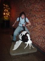 John riding his giant fish to glory